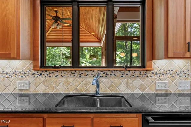 an empty room with windows and entrance