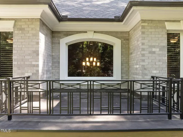 an aerial view of a house with yard porch and furniture