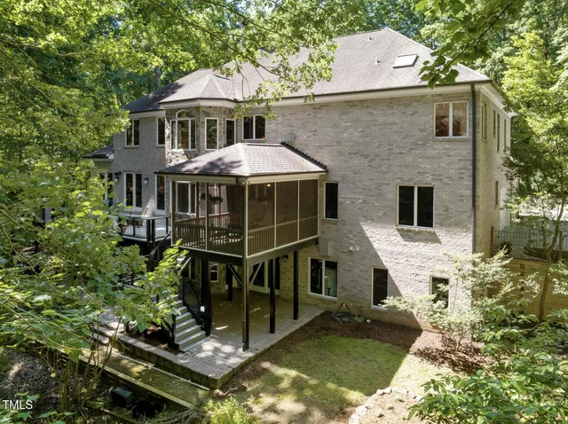 a very nice looking room with a large window and a chandelier
