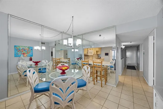 a living room with lots of furniture and a chandelier