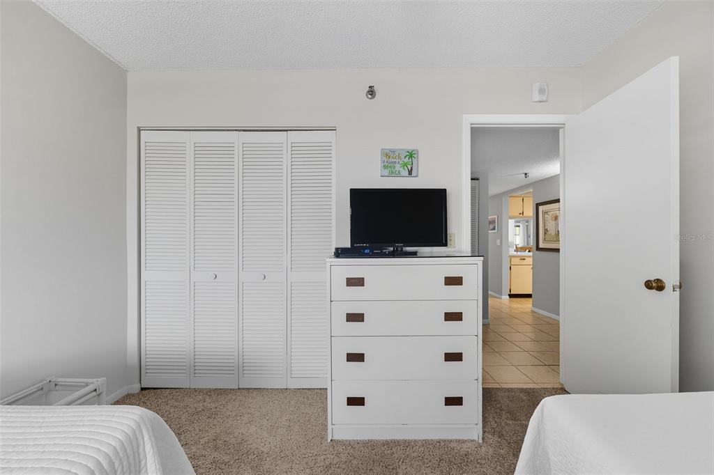 13720 Gulf Boulevard, Unit 609 Madeira Beach, FL 33708 - Photo 21 of 40 a view of bedroom with a flat screen tv