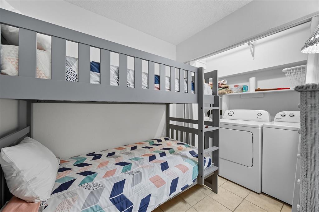 13720 Gulf Boulevard, Unit 609 Madeira Beach, FL 33708 - Photo 24 of 40 a bedroom with a bed and a window