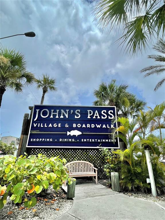13720 Gulf Boulevard, Unit 609 Madeira Beach, FL 33708 - Photo 33 of 40 a front view of a house with a garden