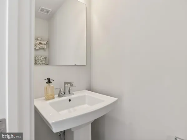 a white sink sitting next to a white sink