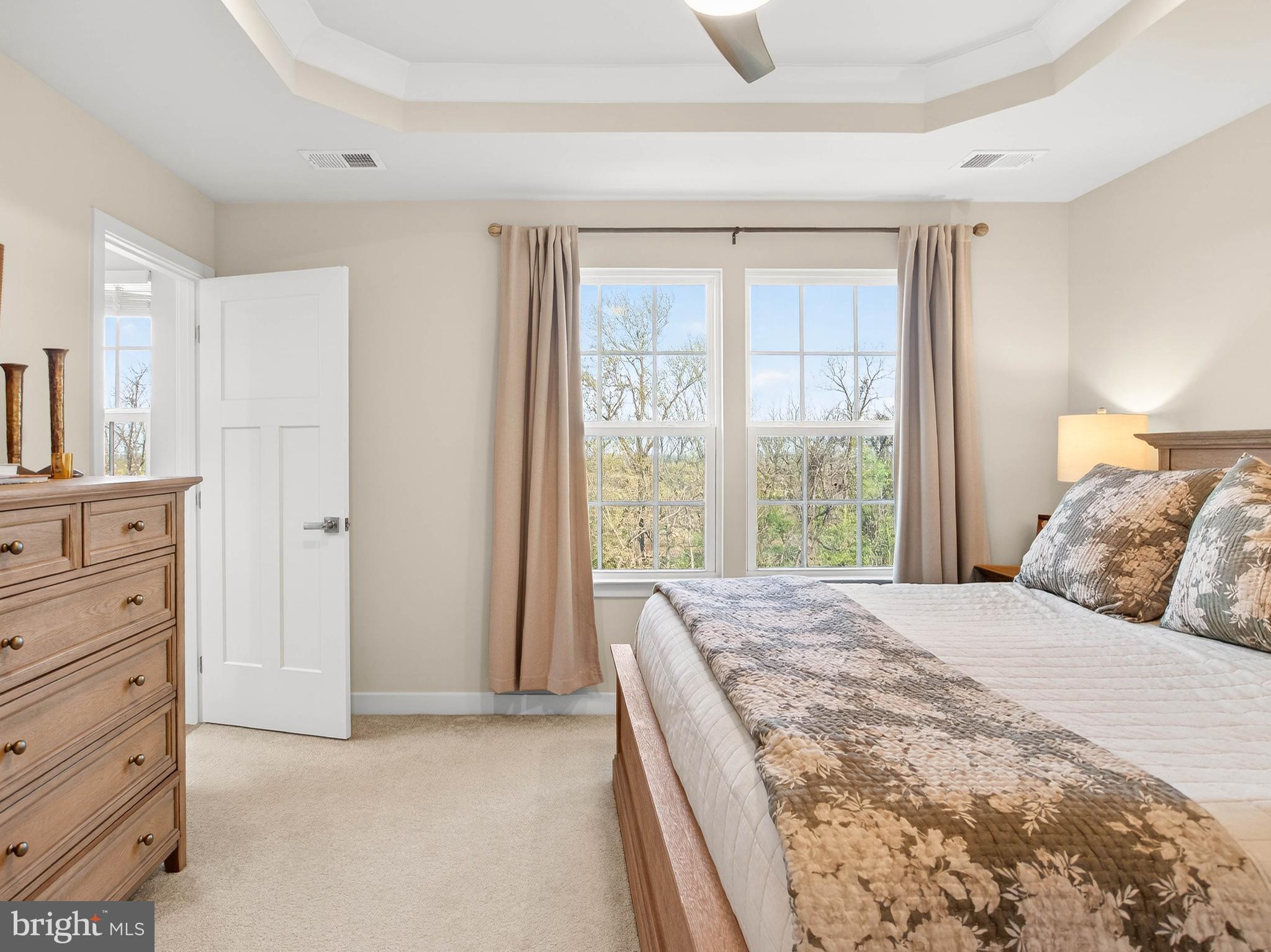 1724 Scenic Loop Culpeper, VA 22701 - Photo 15 of 29 a bedroom with a large bed and a dresser