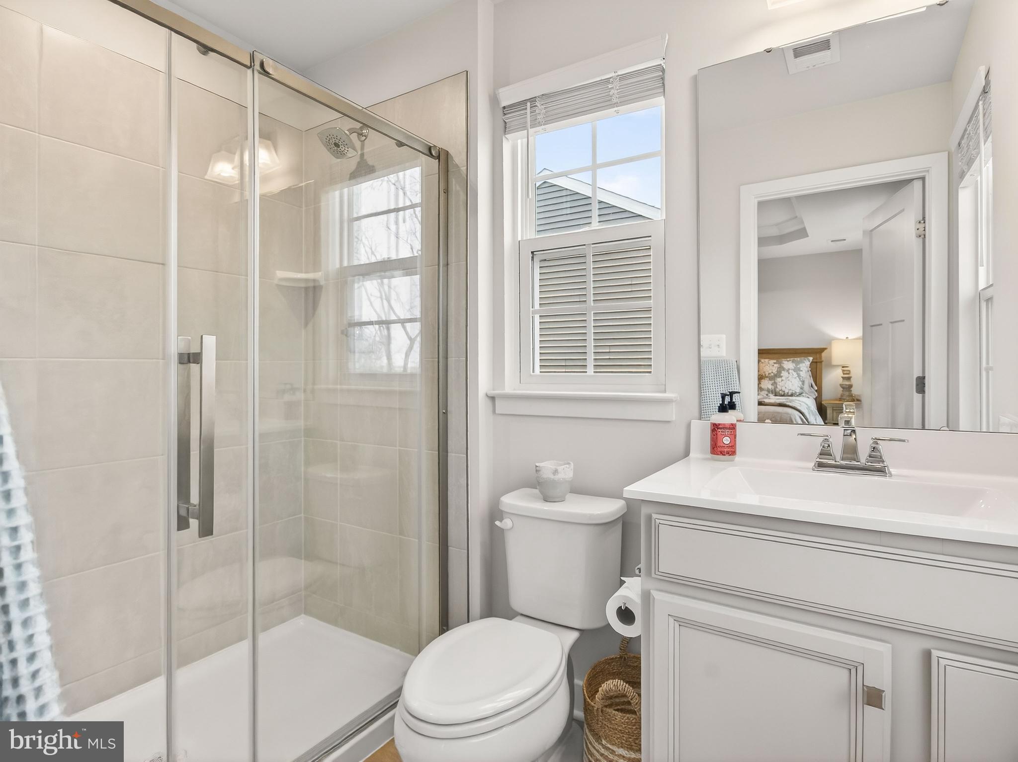 1724 Scenic Loop Culpeper, VA 22701 - Photo 18 of 29 a bathroom with a sink toilet vanity and shower