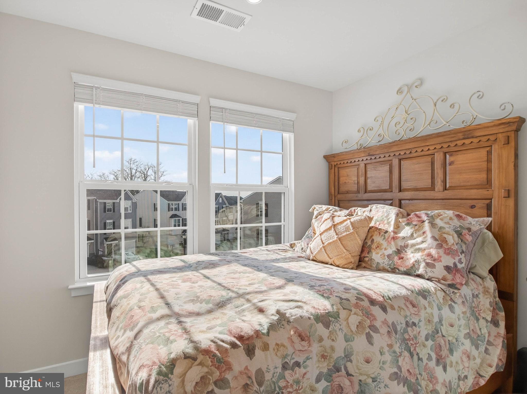 1724 Scenic Loop Culpeper, VA 22701 - Photo 19 of 29 a bedroom with a large bed and a large window