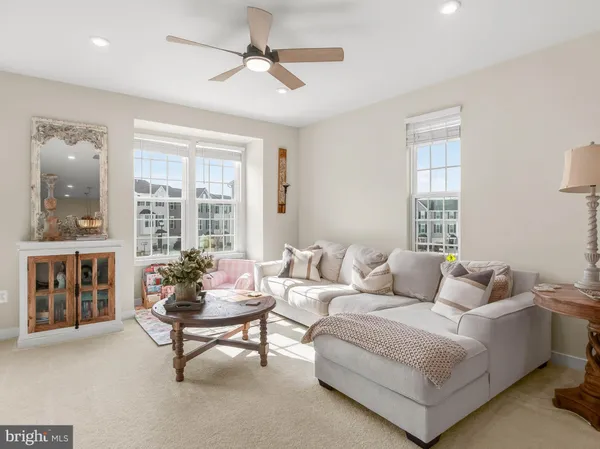 a living room with furniture and windows