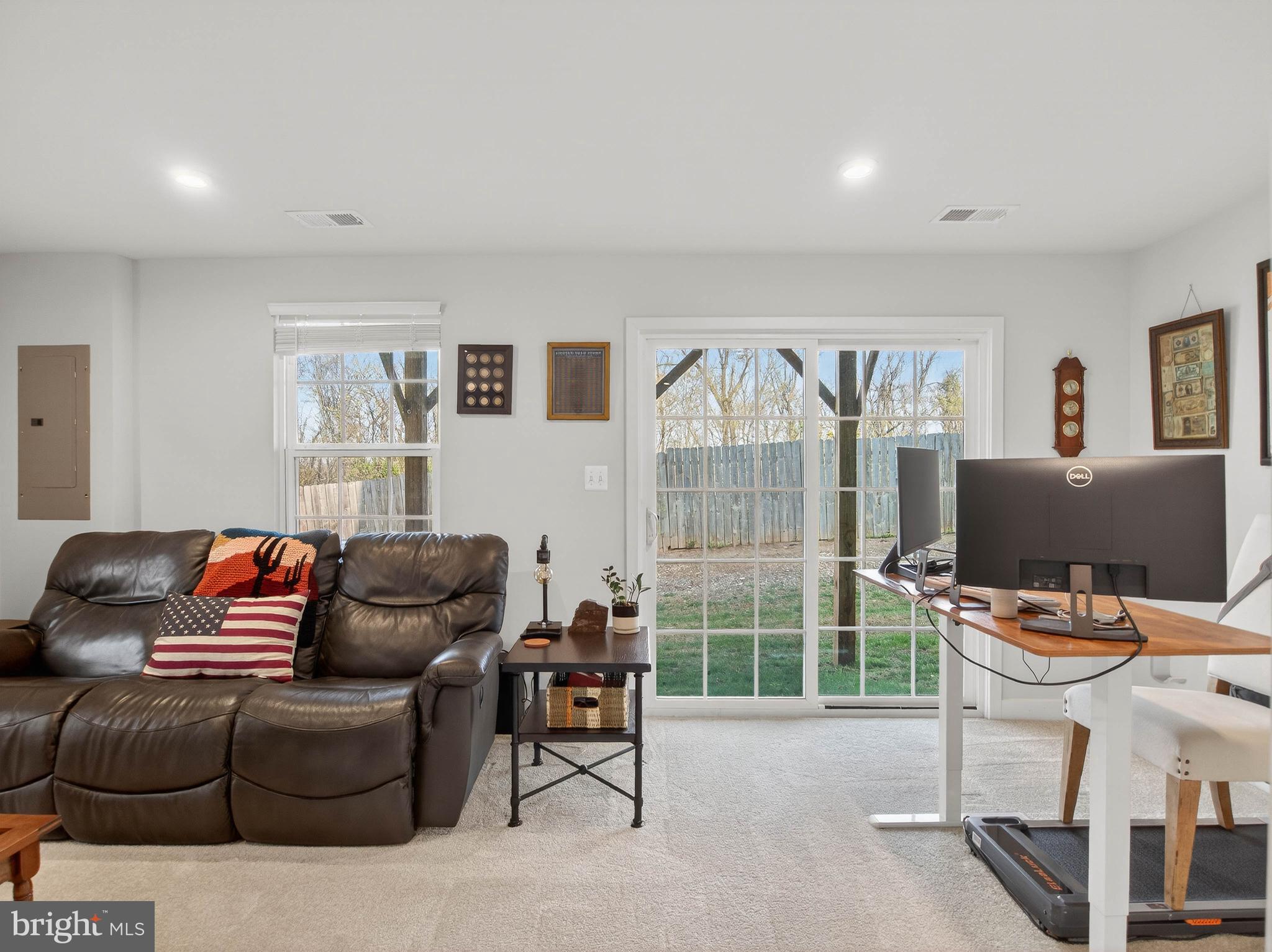 1724 Scenic Loop Culpeper, VA 22701 - Photo 24 of 29 a living room with furniture a flat screen tv and a window