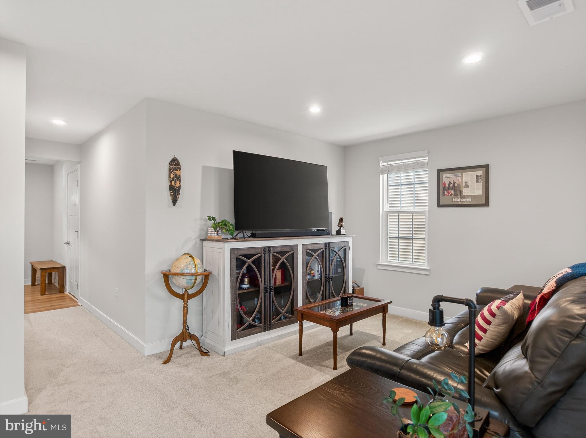 1724 Scenic Loop Culpeper, VA 22701 - Photo 25 of 29 a living room with furniture and a flat screen tv