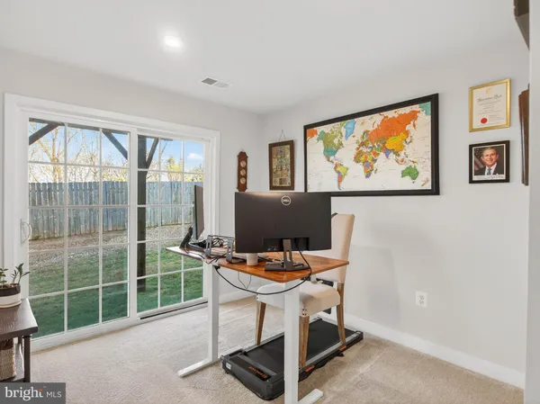 a workspace with furniture and window