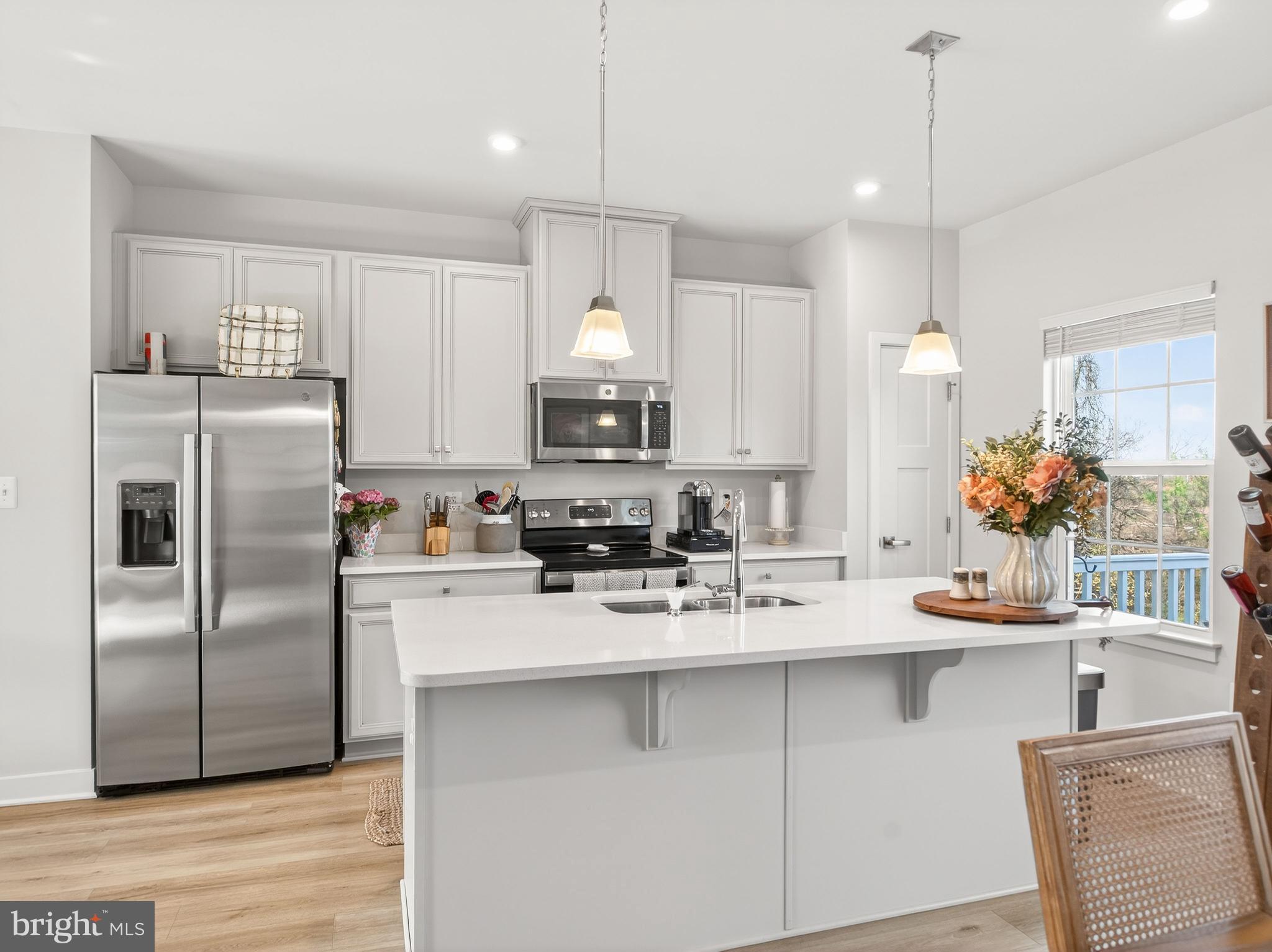 1724 Scenic Loop Culpeper, VA 22701 - Photo 7 of 29 a kitchen with kitchen island a sink stove and refrigerator