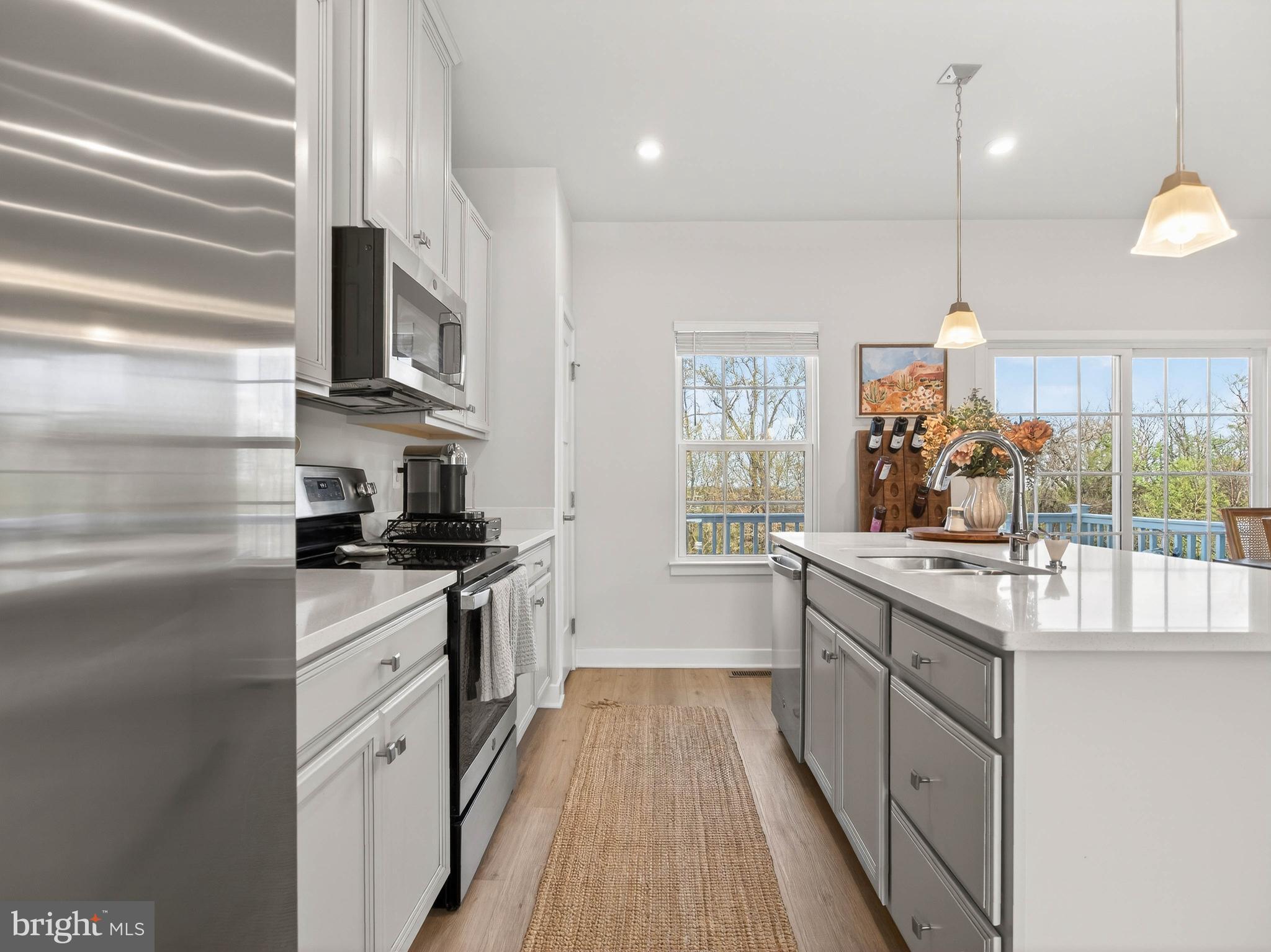1724 Scenic Loop Culpeper, VA 22701 - Photo 9 of 29 a kitchen with stainless steel appliances granite countertop a sink and stove top oven