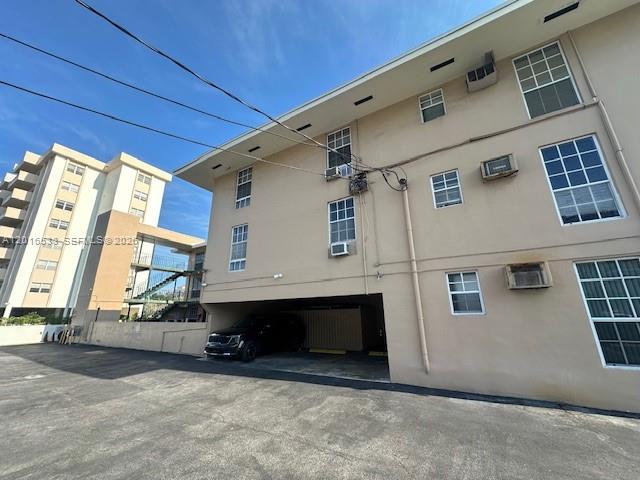 1400 Douglas Road, Unit 14 Coral Gables, FL 33134 - Photo 4 of 19 a view of front door and yard