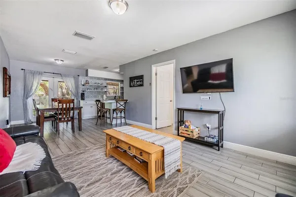 a living room with furniture and a window