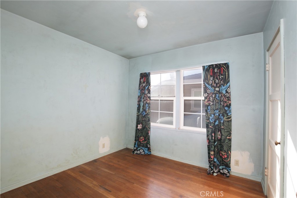 1618 West 9th Street Santa Ana, CA 92703 - Photo 15 of 29 an empty room with windows and closet