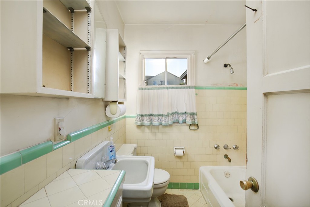 1618 West 9th Street Santa Ana, CA 92703 - Photo 16 of 29 a bathroom with a bathtub and a shower