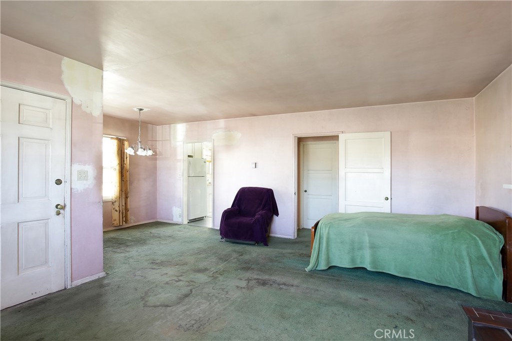 1618 West 9th Street Santa Ana, CA 92703 - Photo 5 of 29 a spacious bedroom with a bed and a couch