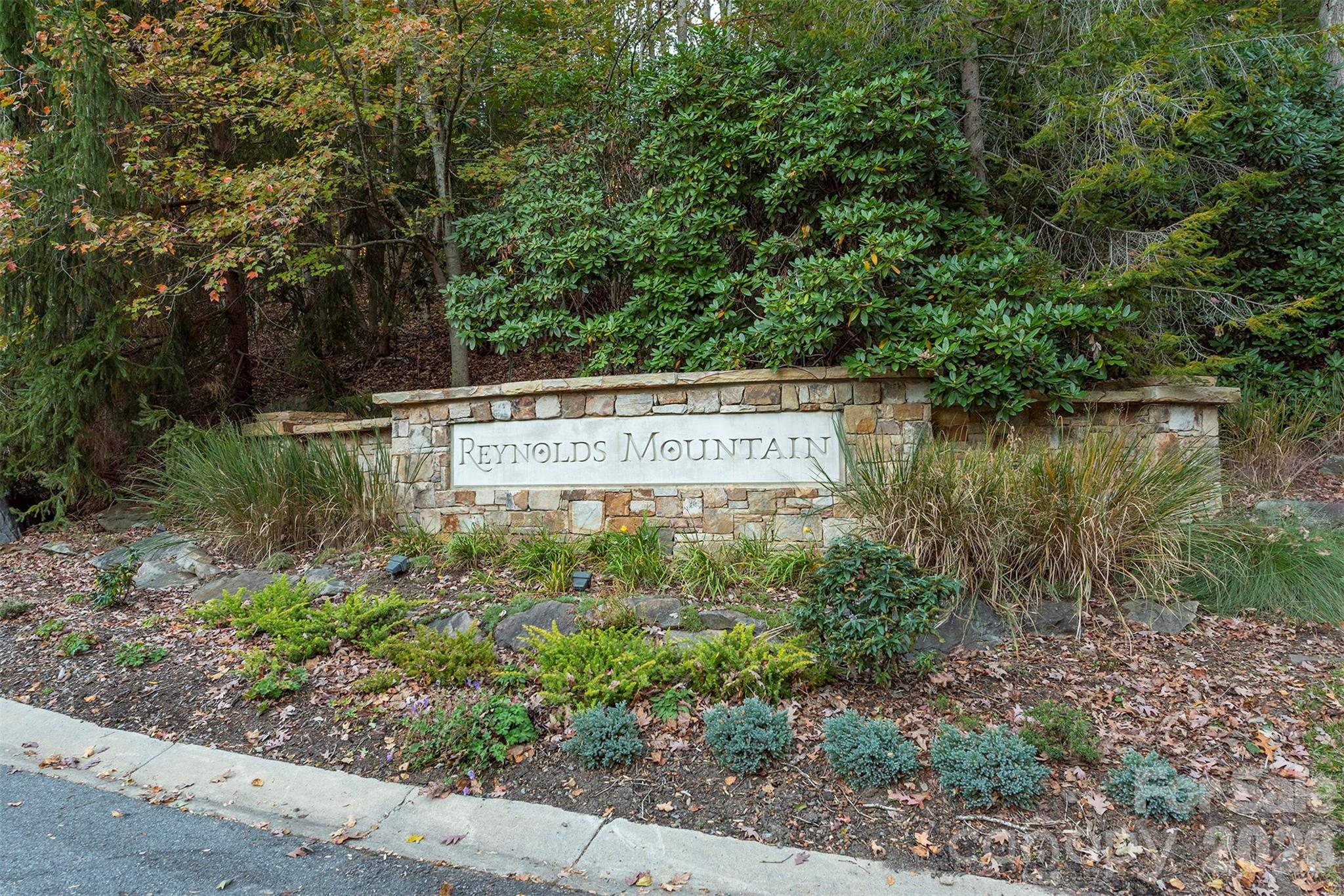 510 Sweetspire Ridge Asheville, NC 28804 - Photo 21 of 24 a view of a sign in a garden