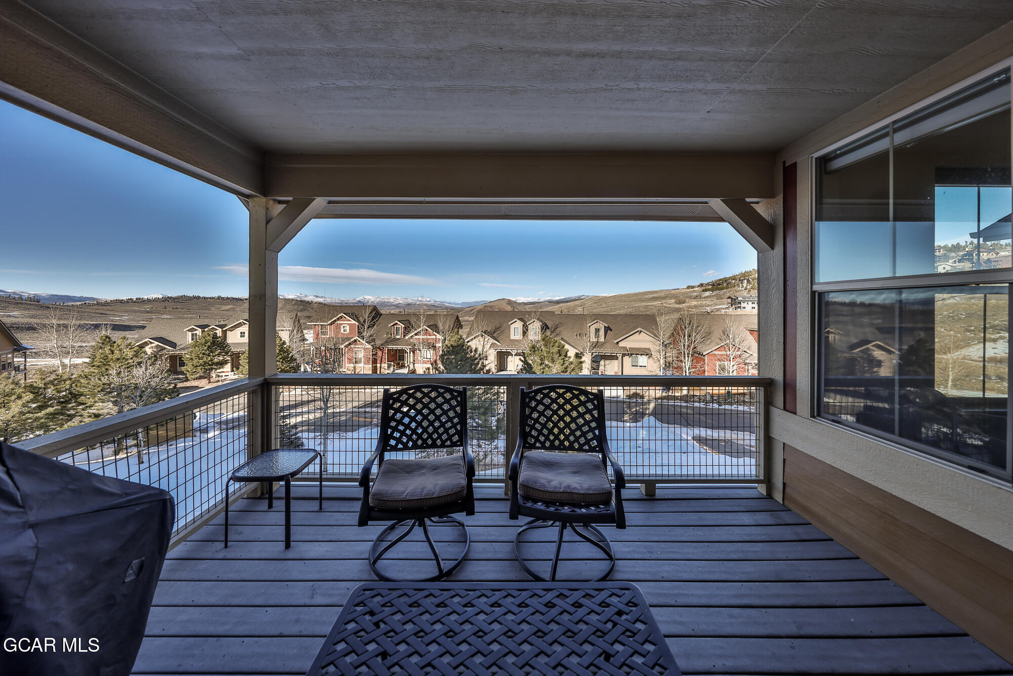 113 Summit Point Lane Granby, CO 80446 - Photo 12 of 43 a view of a balcony with furniture and wooden floor