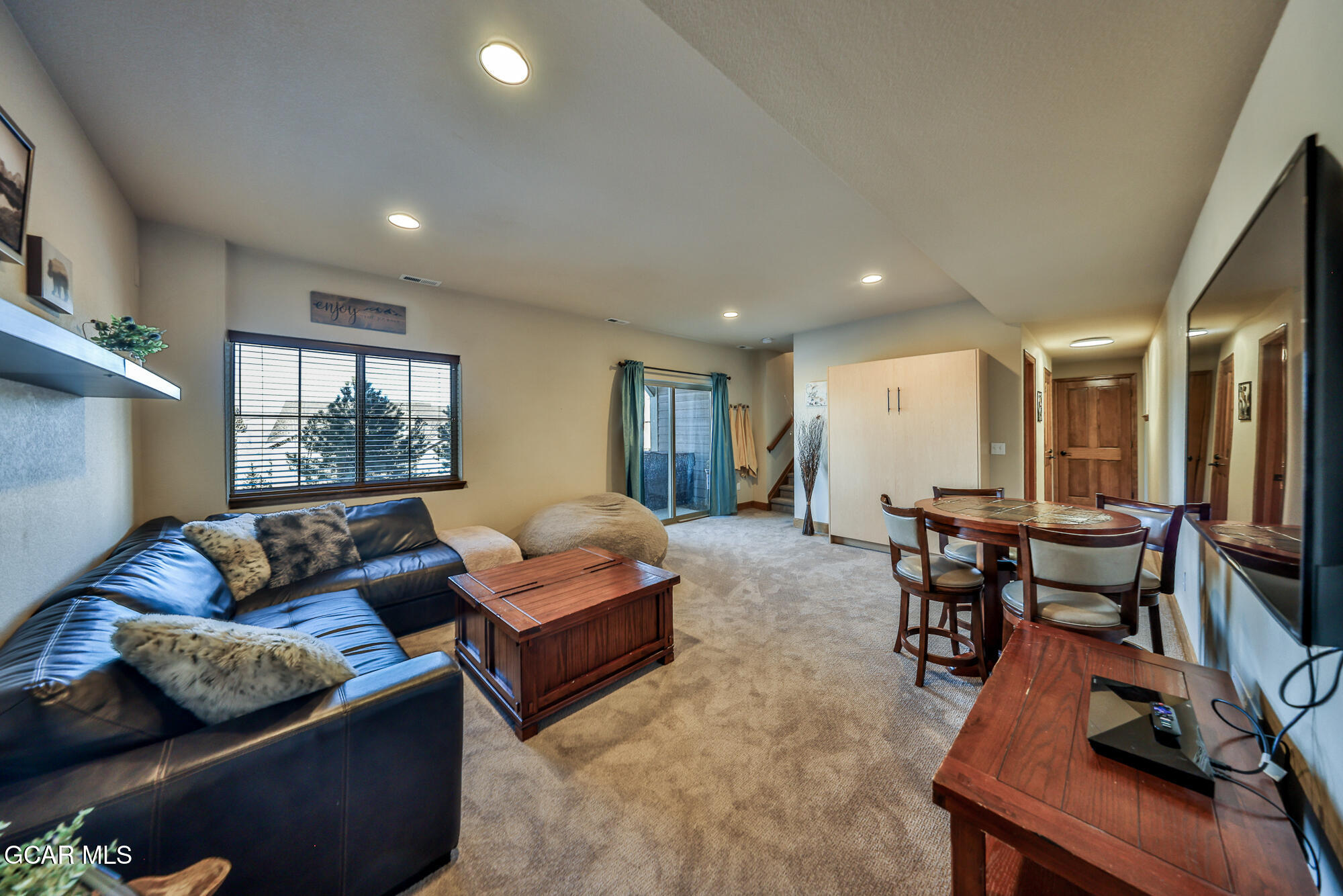 113 Summit Point Lane Granby, CO 80446 - Photo 22 of 43 a living room with furniture and wooden floor