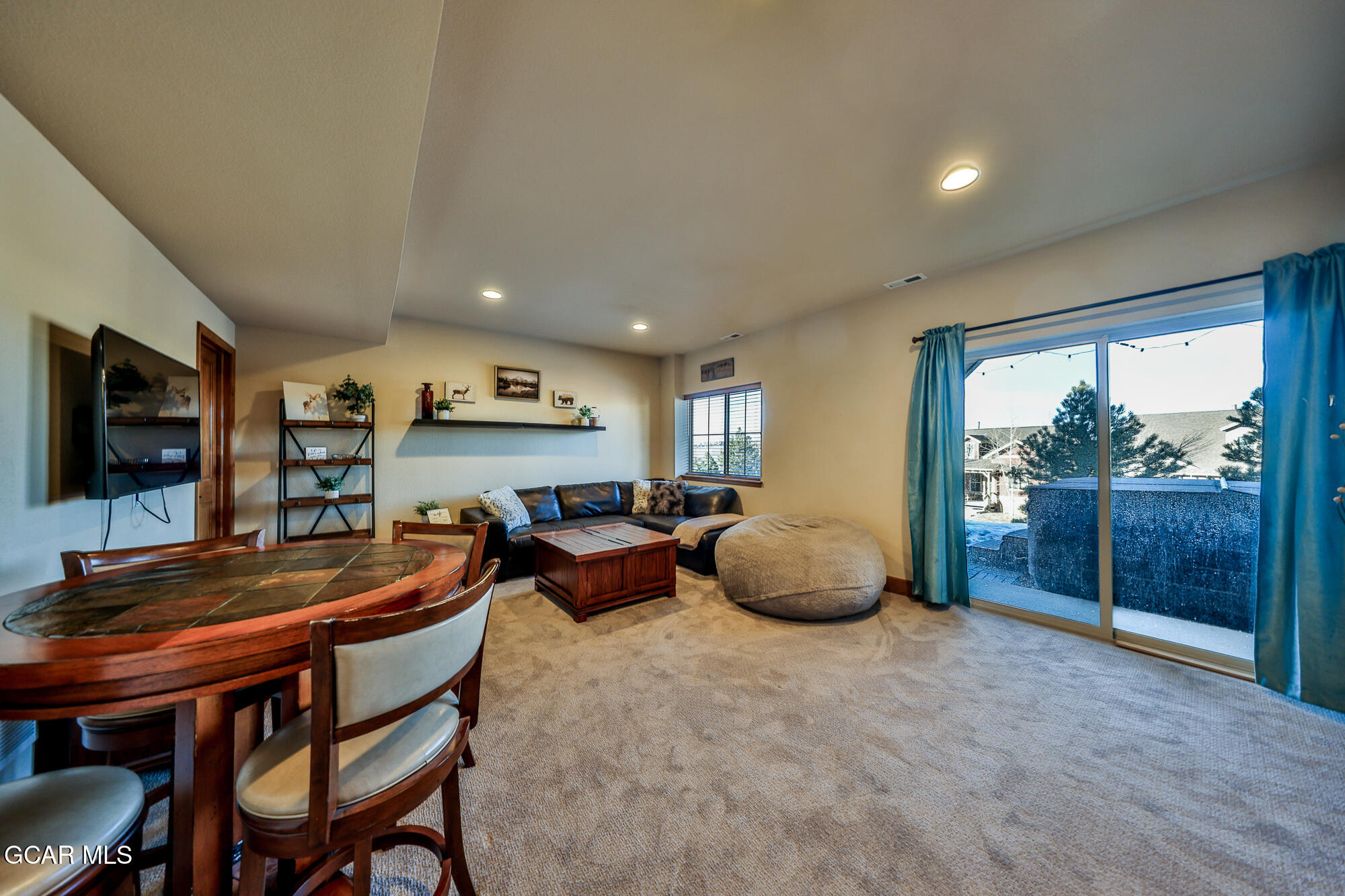 113 Summit Point Lane Granby, CO 80446 - Photo 23 of 43 a room with furniture and a flat screen tv