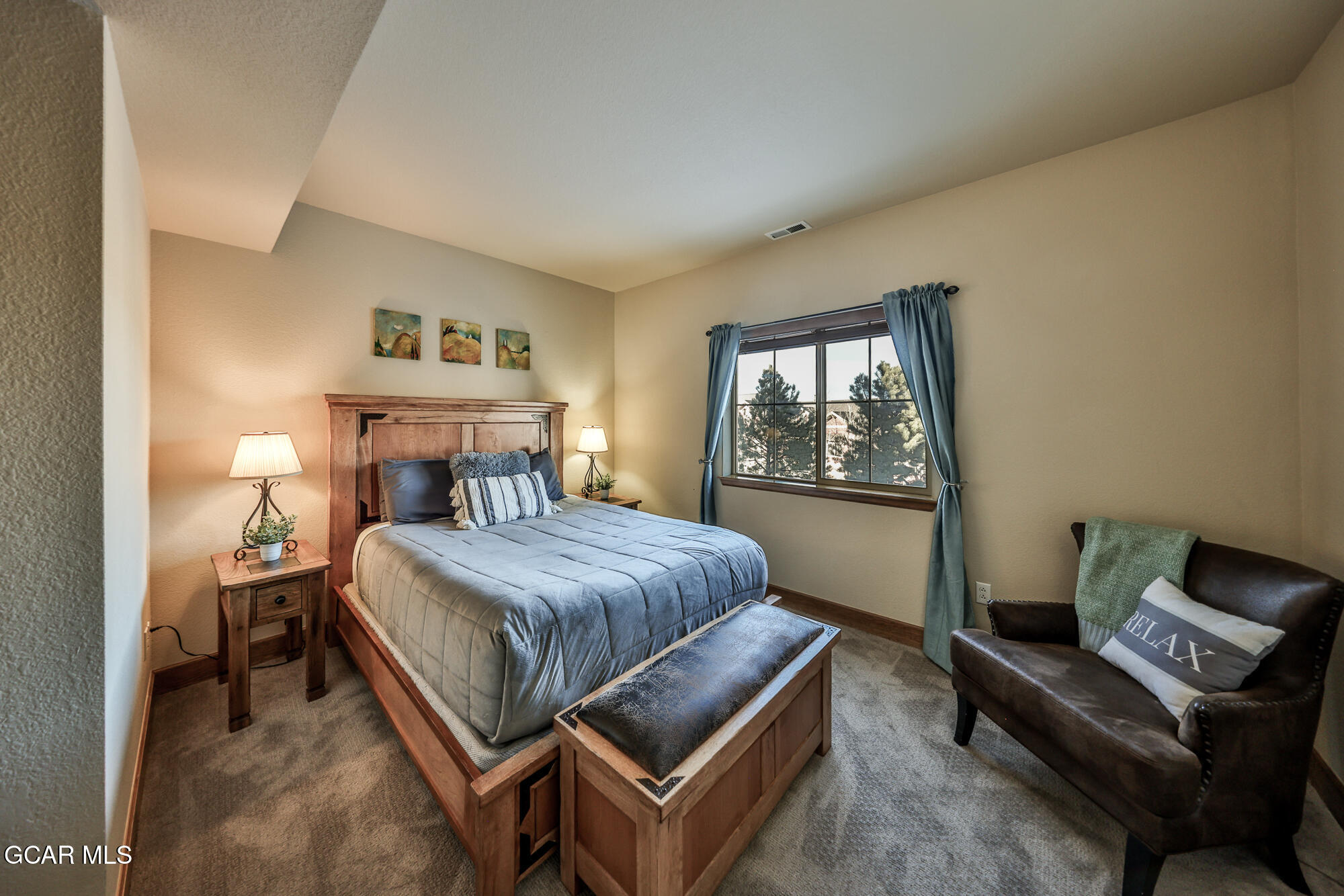 113 Summit Point Lane Granby, CO 80446 - Photo 25 of 43 a bedroom with a bed couch and window