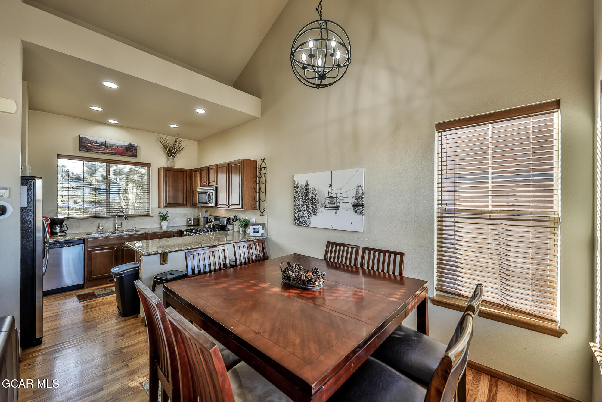 113 Summit Point Lane Granby, CO 80446 - Photo 7 of 43 a view of a dining room with furniture window and wooden floor