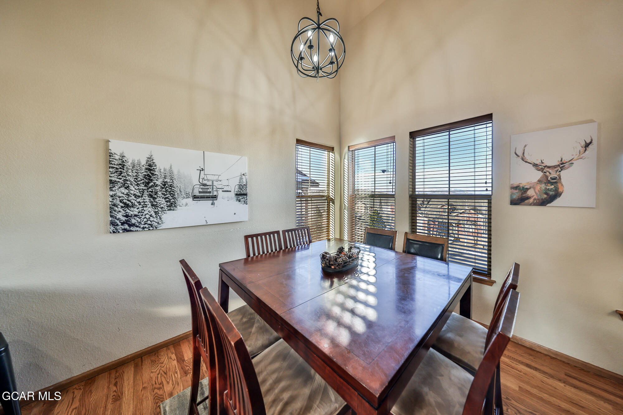 113 Summit Point Lane Granby, CO 80446 - Photo 8 of 43 a view of a dining room with furniture window and wooden floor