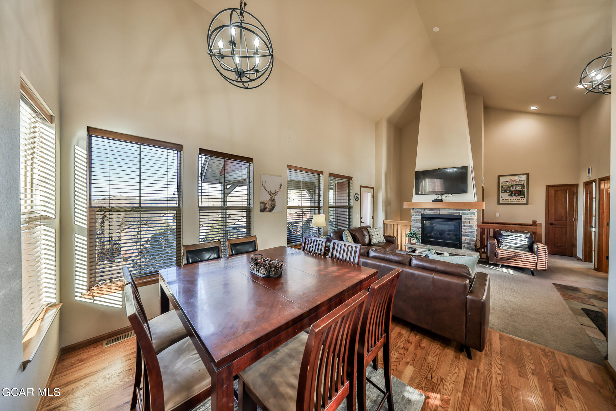 113 Summit Point Lane Granby, CO 80446 - Photo 9 of 43 a view of a dining room with furniture window and wooden floor