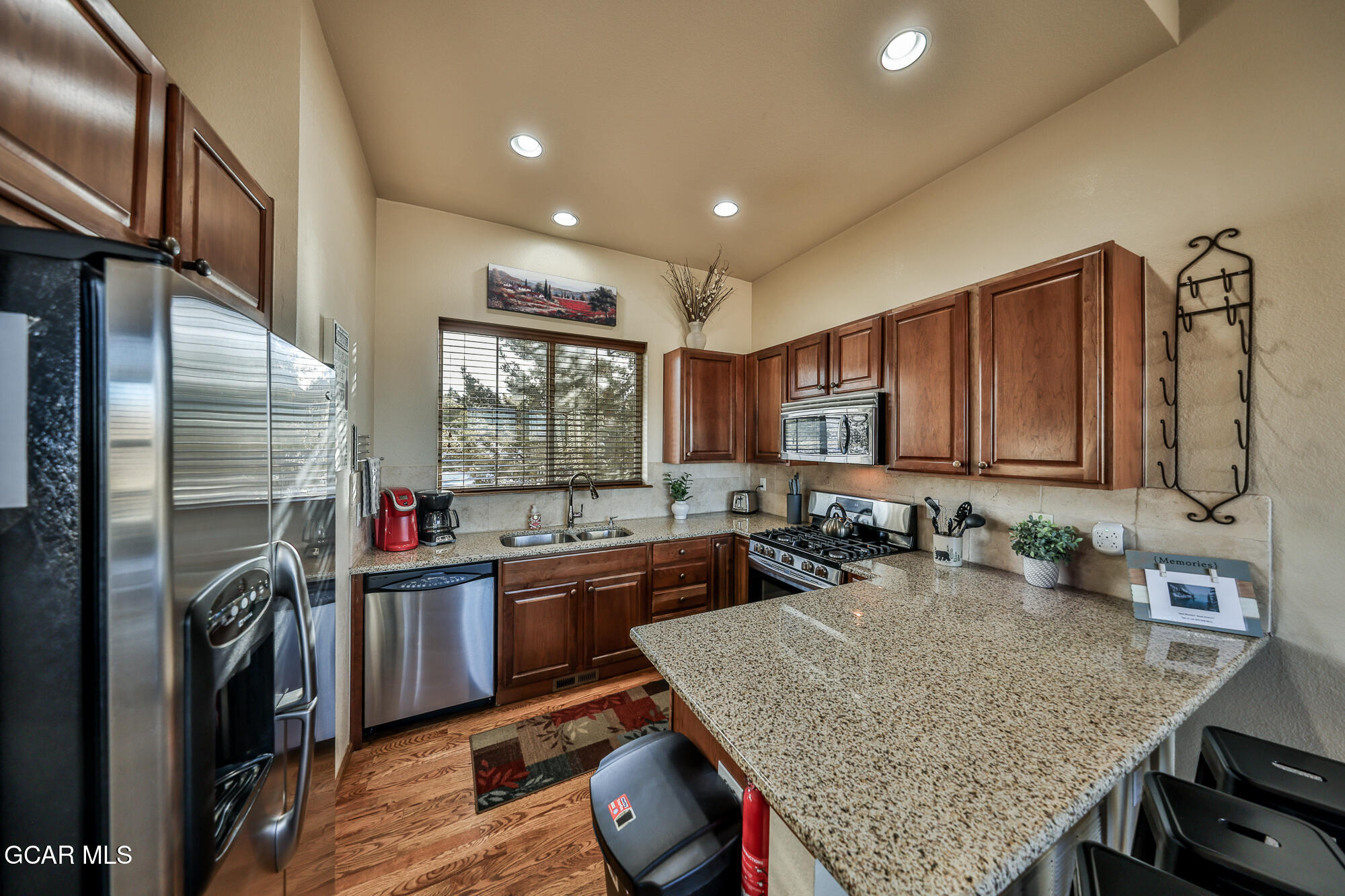113 Summit Point Lane Granby, CO 80446 - Photo 10 of 43 a kitchen with sink stove and refrigerator