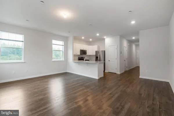 a view of kitchen with wooden floor and window