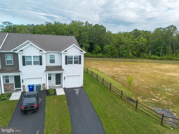 a aerial view of a house with swimming pool garden and patio