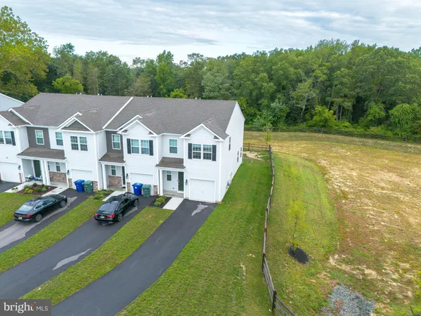 a aerial view of a house with a yard
