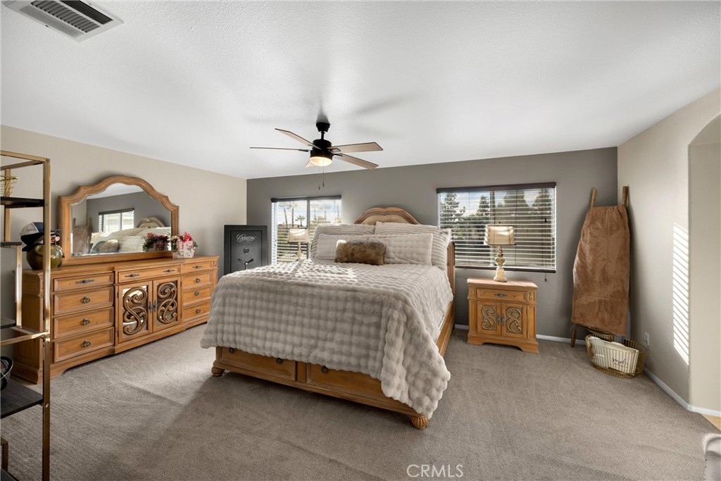 6861 Rio Grande Drive Eastvale, CA 91752 - Photo 16 of 36 a bedroom with a bed and a dresser