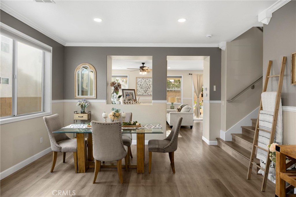6861 Rio Grande Drive Eastvale, CA 91752 - Photo 4 of 36 a view of a a dining room with furniture window and wooden floor
