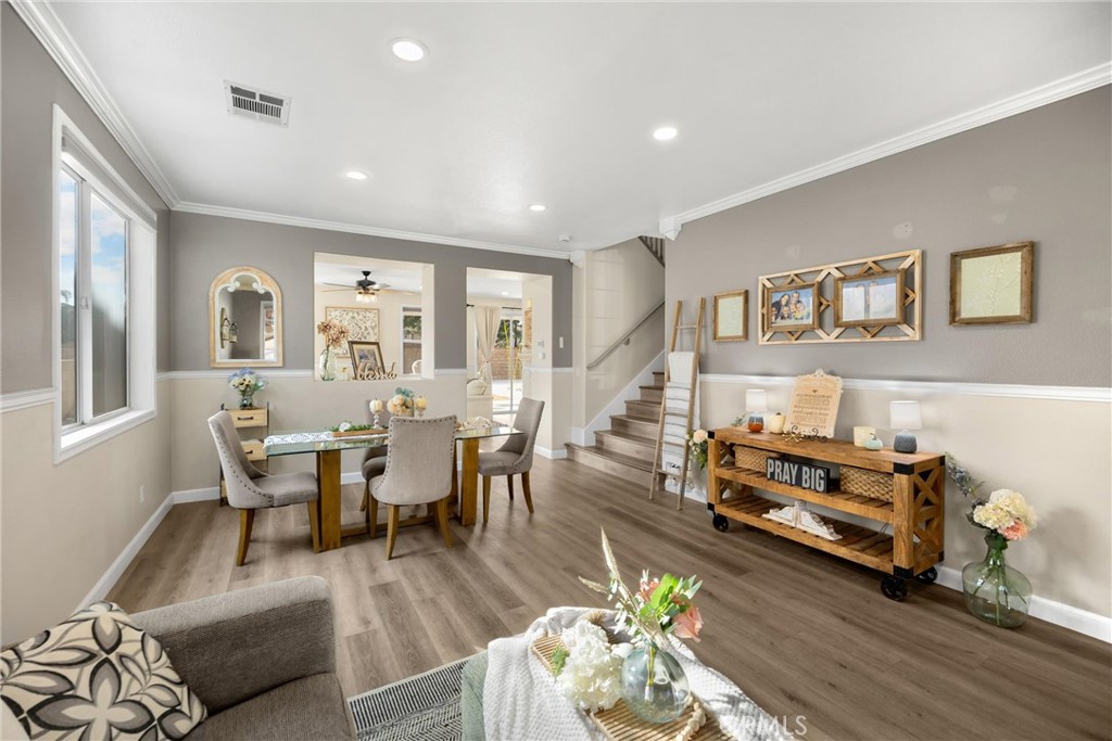 6861 Rio Grande Drive Eastvale, CA 91752 - Photo 5 of 36 a view of a dining room with furniture and wooden floor
