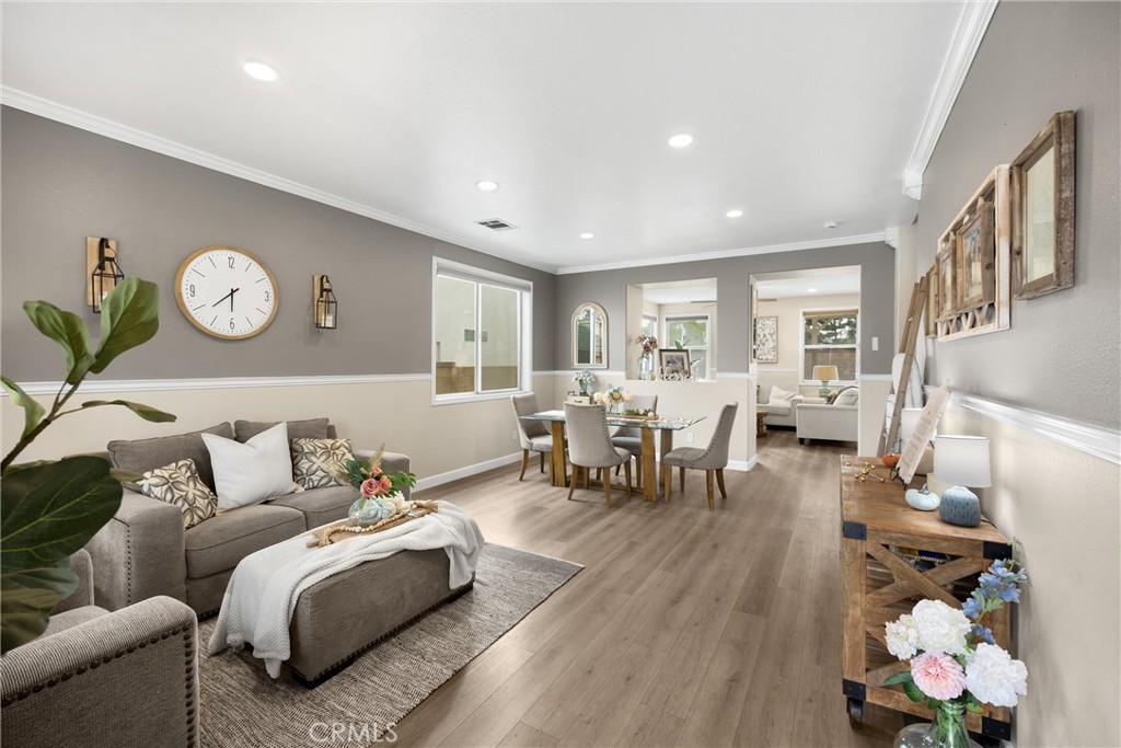 6861 Rio Grande Drive Eastvale, CA 91752 - Photo 6 of 36 a living room with furniture and wooden floor