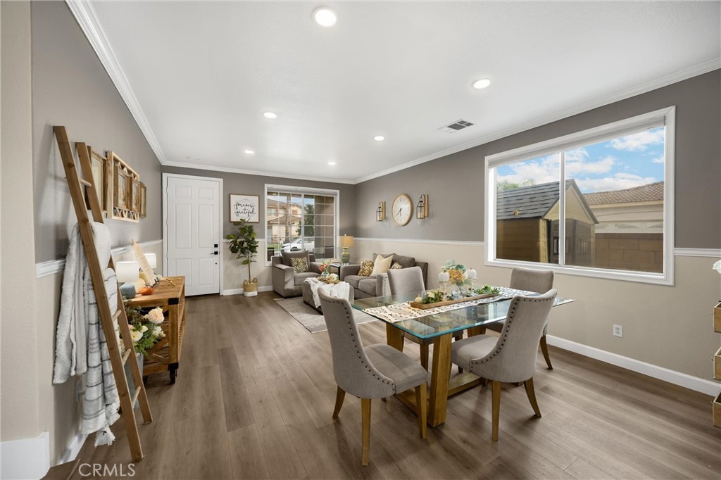 6861 Rio Grande Drive Eastvale, CA 91752 - Photo 7 of 36 a view of a dining room with furniture window and wooden floor