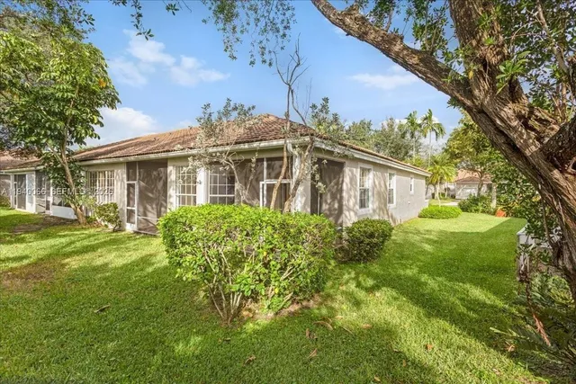 a view of swimming pool with palm trees