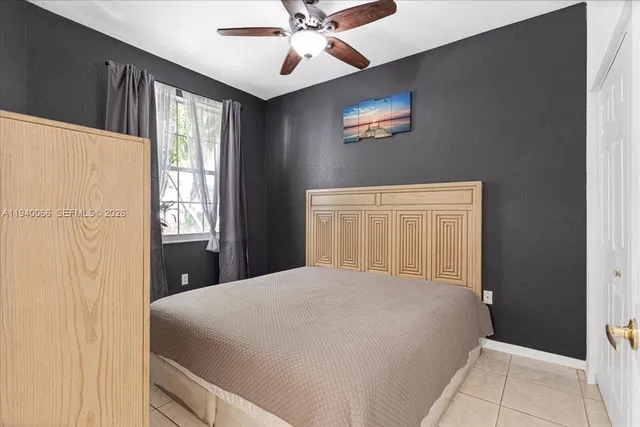 a view of an empty room with a ceiling fan
