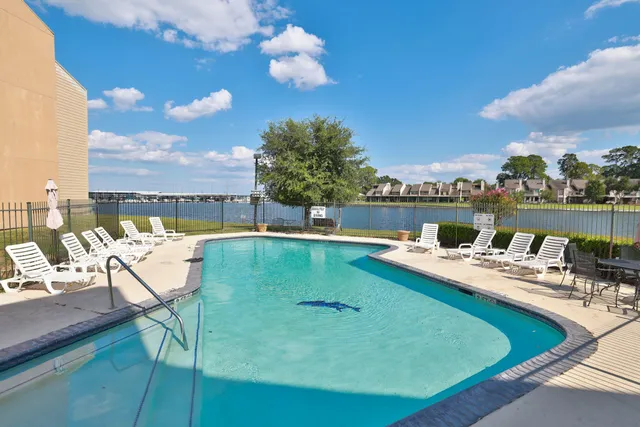 a view of a brick building next to a yard