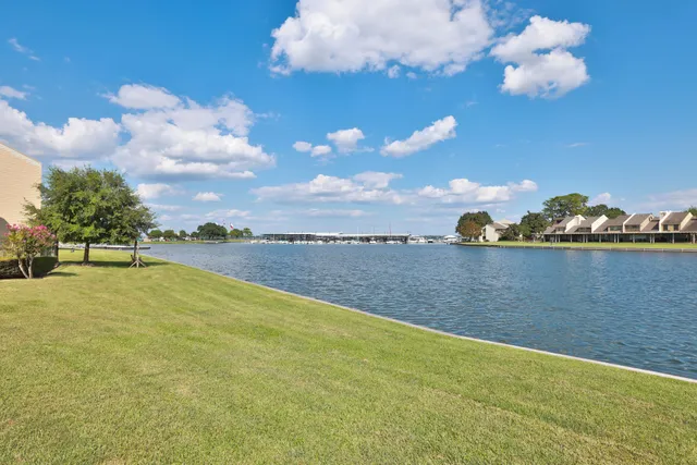 a view of a house with outdoor space and lake view
