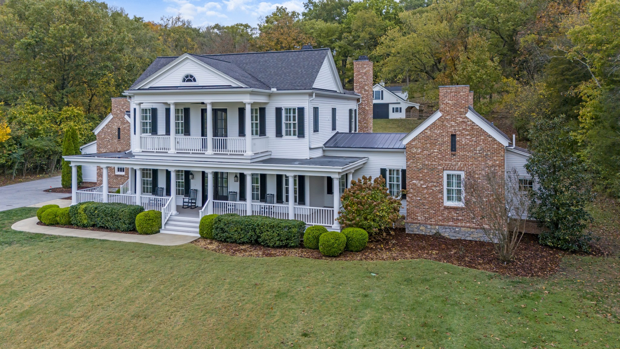 3290 Carl Road Franklin, TN 37064 - Photo 3 of 84 a front view of a house with a yard and potted plants