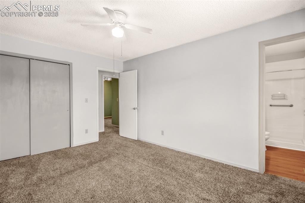 541 Blossom Field Road Fountain, CO 80817 - Photo 12 of 35 an empty room with closet and a ceiling fan