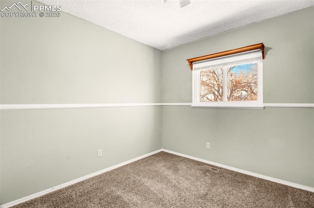 541 Blossom Field Road Fountain, CO 80817 - Photo 16 of 35 an empty room with a window