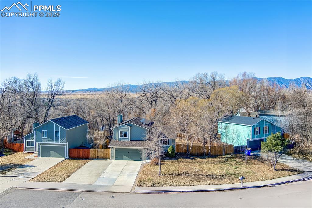 541 Blossom Field Road Fountain, CO 80817 - Photo 26 of 35 a view of a big house with a mountain in the background