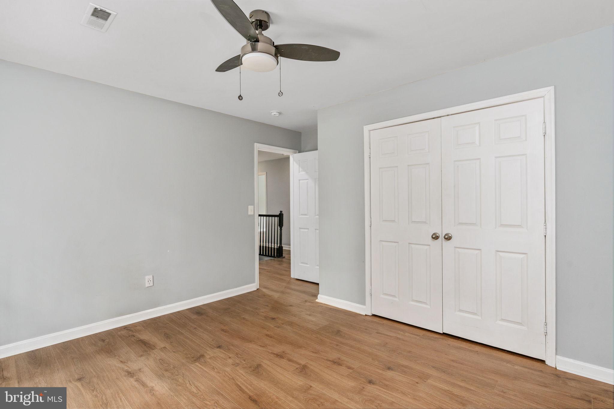 60 River Falls Road Fredericksburg, VA 22406 - Photo 42 of 73 LVP flooring and ceiling fan light fixture