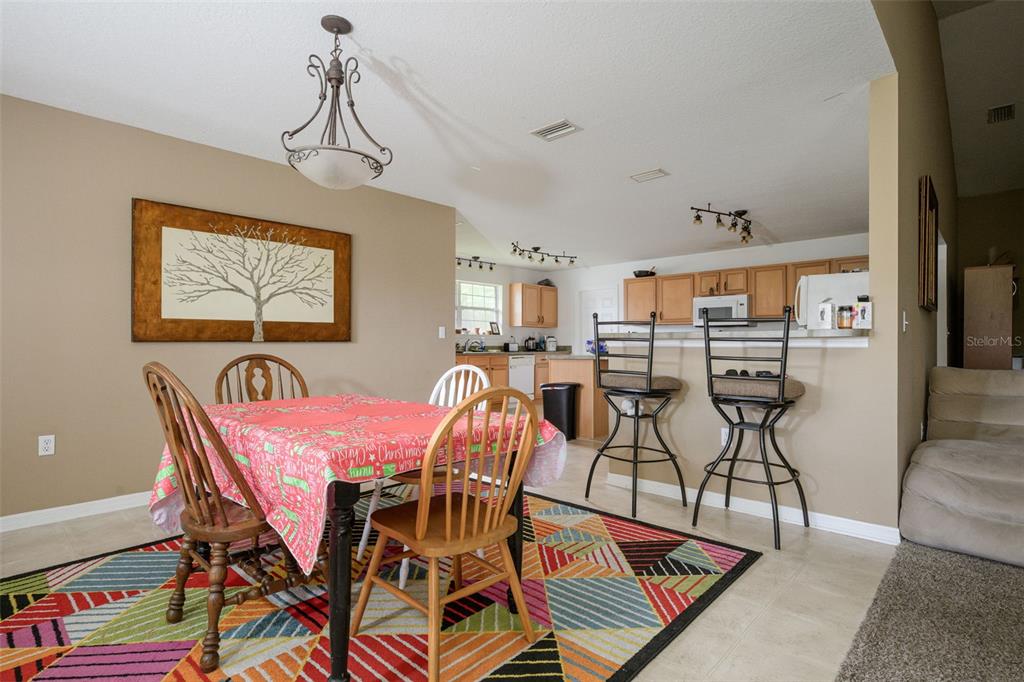 11 Riddle Drive Palm Coast, FL 32164 - Photo 7 of 33 a view of a dining room with furniture