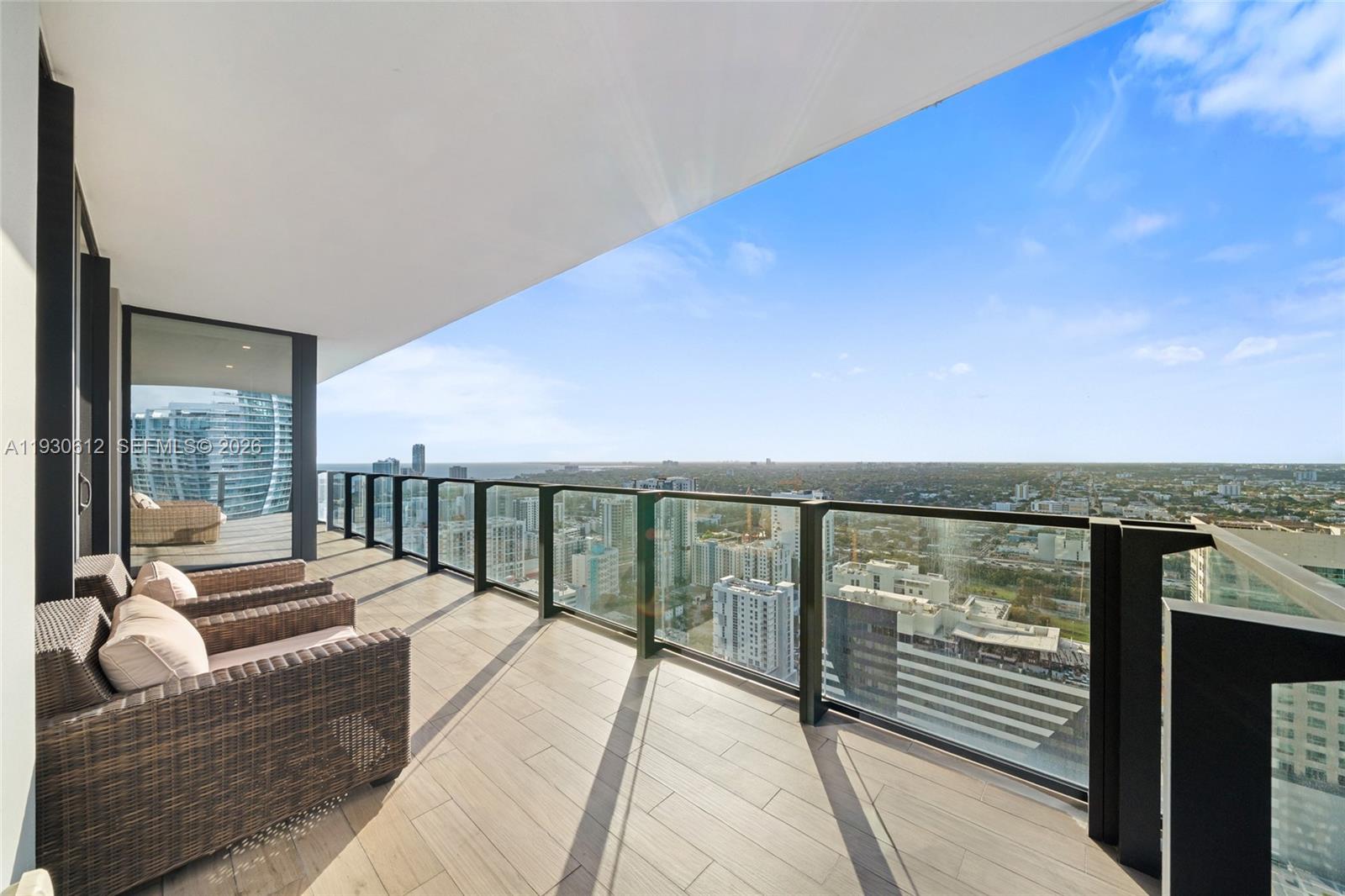 88 Southwest 7th Street, Unit 3212 Miami, FL 33130 - Photo 1 of 2 a balcony with view of ocean